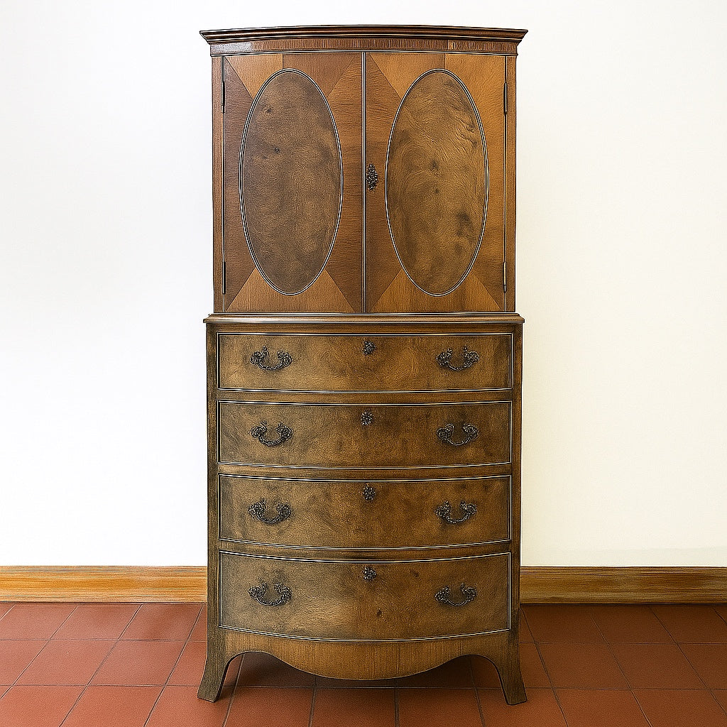 Vintage wooden tallboy cabinet with oval panelled doors and bow-front drawers, shown in its original condition before restoration.