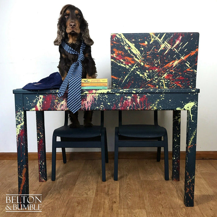 Upcycled children’s desk and chairs with bold paint splatter design in blue, red, yellow, and orange by Belton & Bumble.