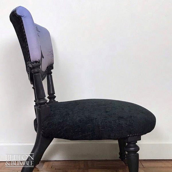 Black Antique Occasional Chair with Purple and Black Upholstery – angled view showing proportions and stance