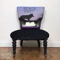 Black Antique Occasional Chair with Purple and Black Upholstery – Styled product shot with complementary décor to suggest scale