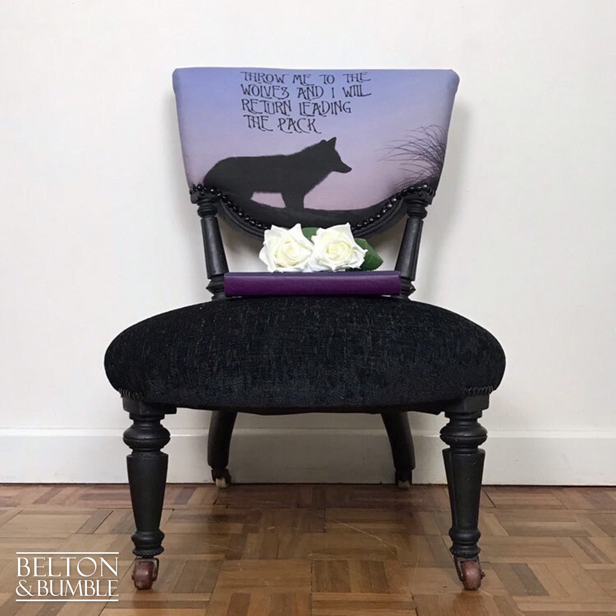 Black Antique Occasional Chair with Purple and Black Upholstery – Styled product shot with complementary décor to suggest scale