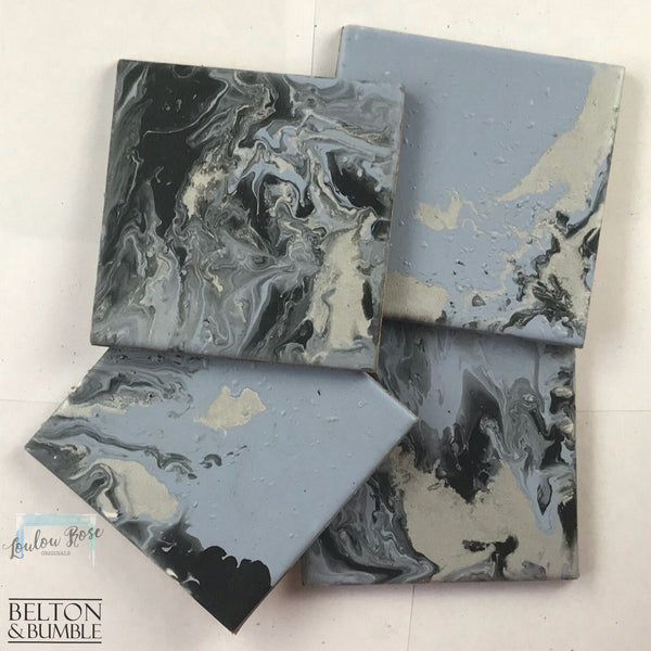 Blue, Silver & Black Acrylic Pour Coasters — angled stack highlighting thickness and gloss