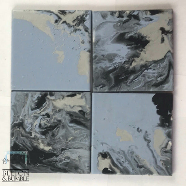 Blue, Silver & Black Acrylic Pour Coasters — overhead grid showing full 4-piece set