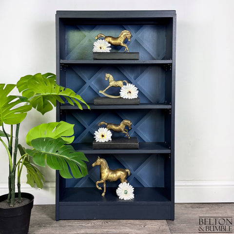 Freestanding Bookcase in Navy Blue with Adjustable Shelves — Styled product shot with books and décor in a modern interior