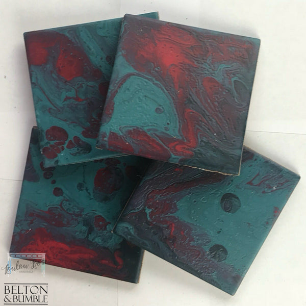 Green & Red Acrylic Pour Coasters — angled stack highlighting thickness and gloss