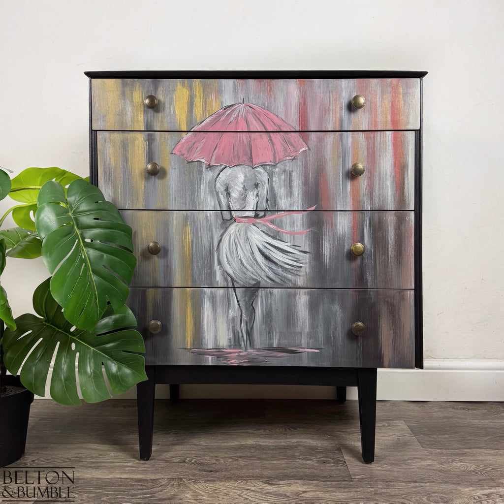 Jet-black chest of drawers with hand-painted figure and pink umbrella design