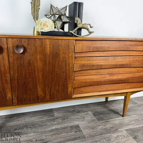 Harris Lebus Vintage English Teak Sideboard – front view showing handles and teak grain
