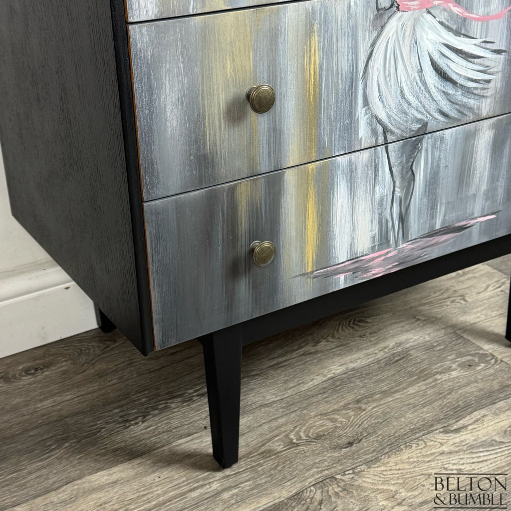 Bottom drawers showing gold and silver tones with hand-painted skirt detail and brass knobs.