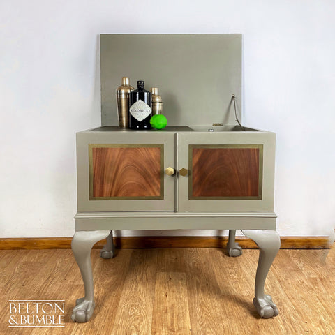 Mahogany Cocktail Cabinet in Green Grey and Bronze – Styled product shot with complementary decor to suggest scale