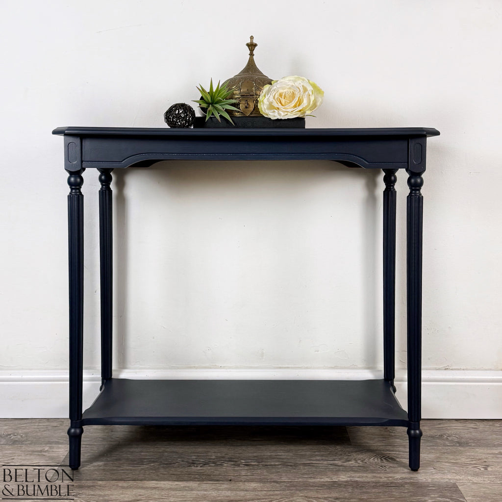 Mahogany and Burr Poplar Console Table in Navy Blue – Styled product shot with complementary decor to suggest scale