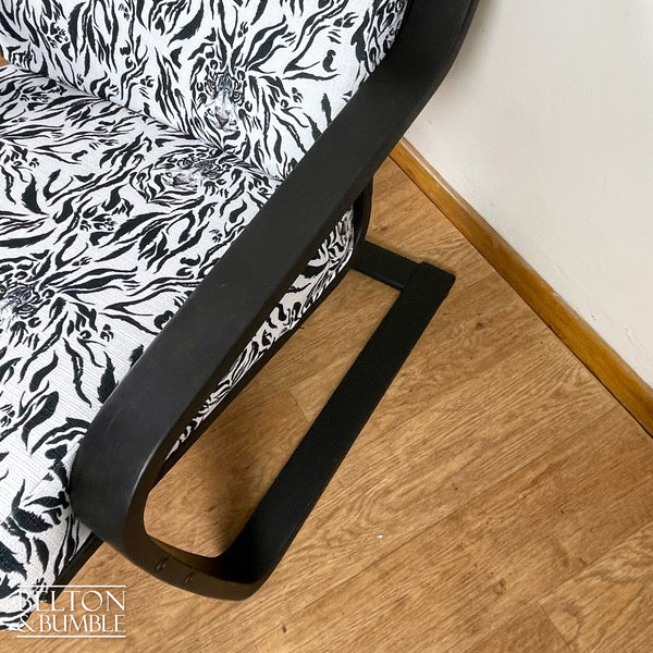 Monochrome Rocker Chair with Tiger Print – Close-up of painted wood finish 