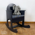 Navy Childs Rocking Chair – Styled product shot with complementary decor to suggest scale