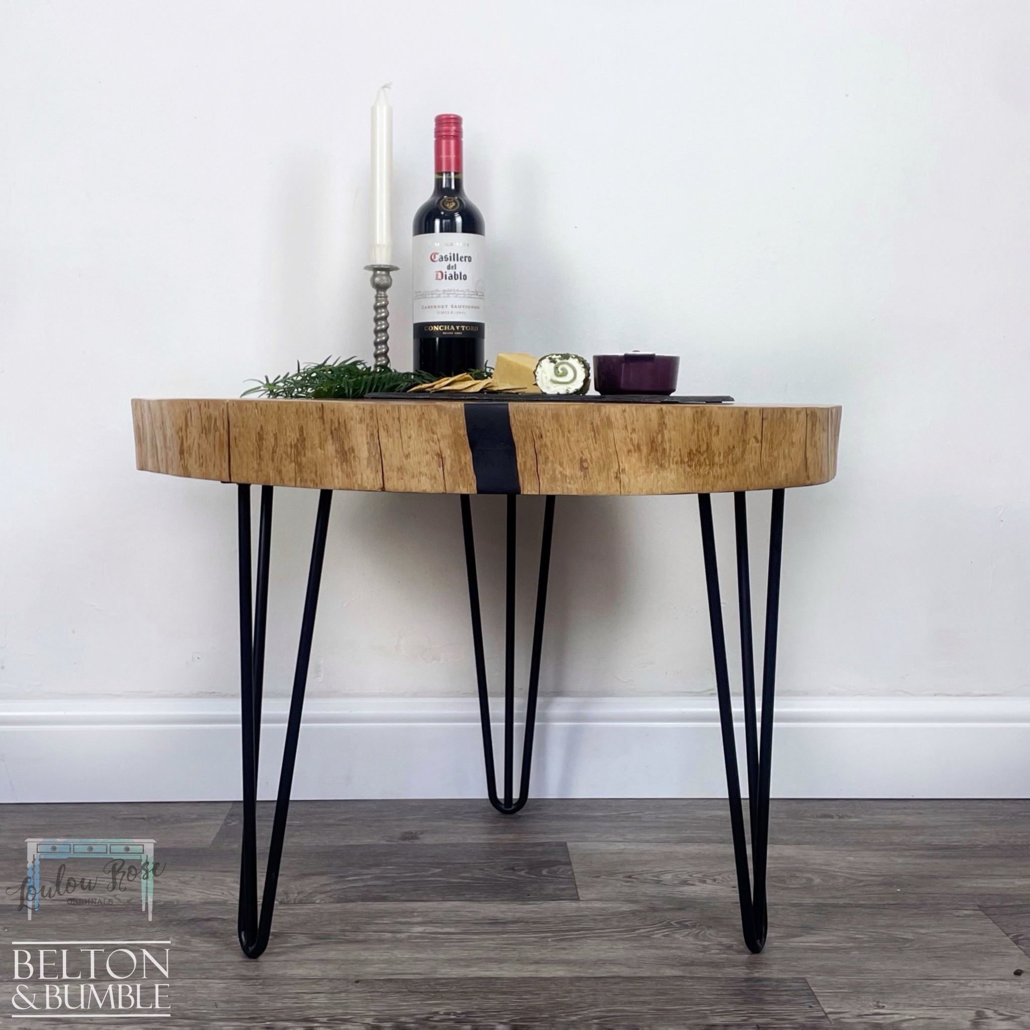 Oak Slice Black Resin Coffee Table – Styled product shot with complementary decor to suggest scale