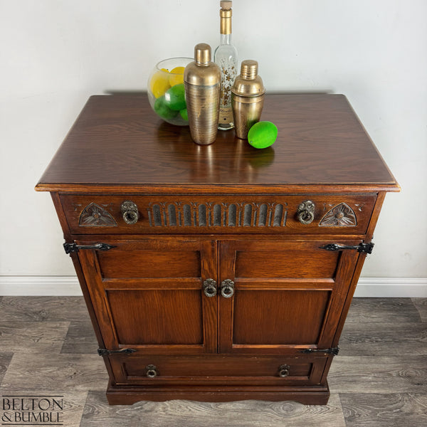 Old Charm Furniture Drinks Cabinet / Entertainment Unit — angled view showing carved panels and bracket feet