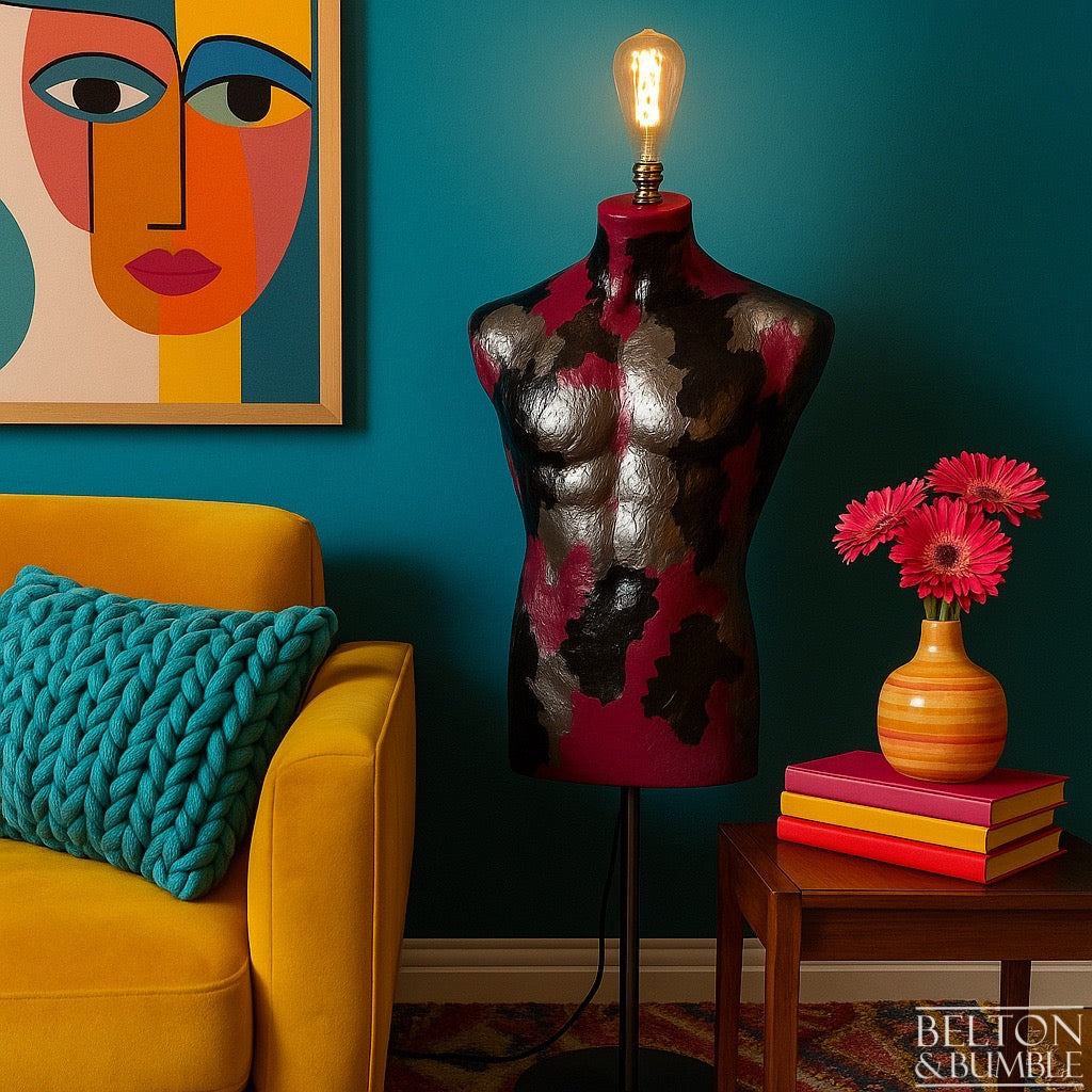 Pink, Black and Silver Mannequin Floor Lamp with Stainless Steel Stand - Decorative interior with a colourful lamp, sofa, and artwork on a blue wall.