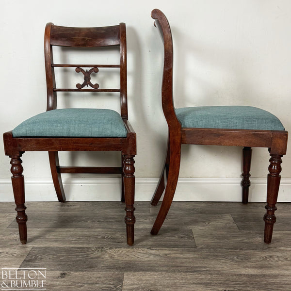 Side and front view of two antique mahogany dining chairs showing their elegant curved backs, turned front legs, and teal upholstered seats, displayed on wood flooring against a plain light wall.