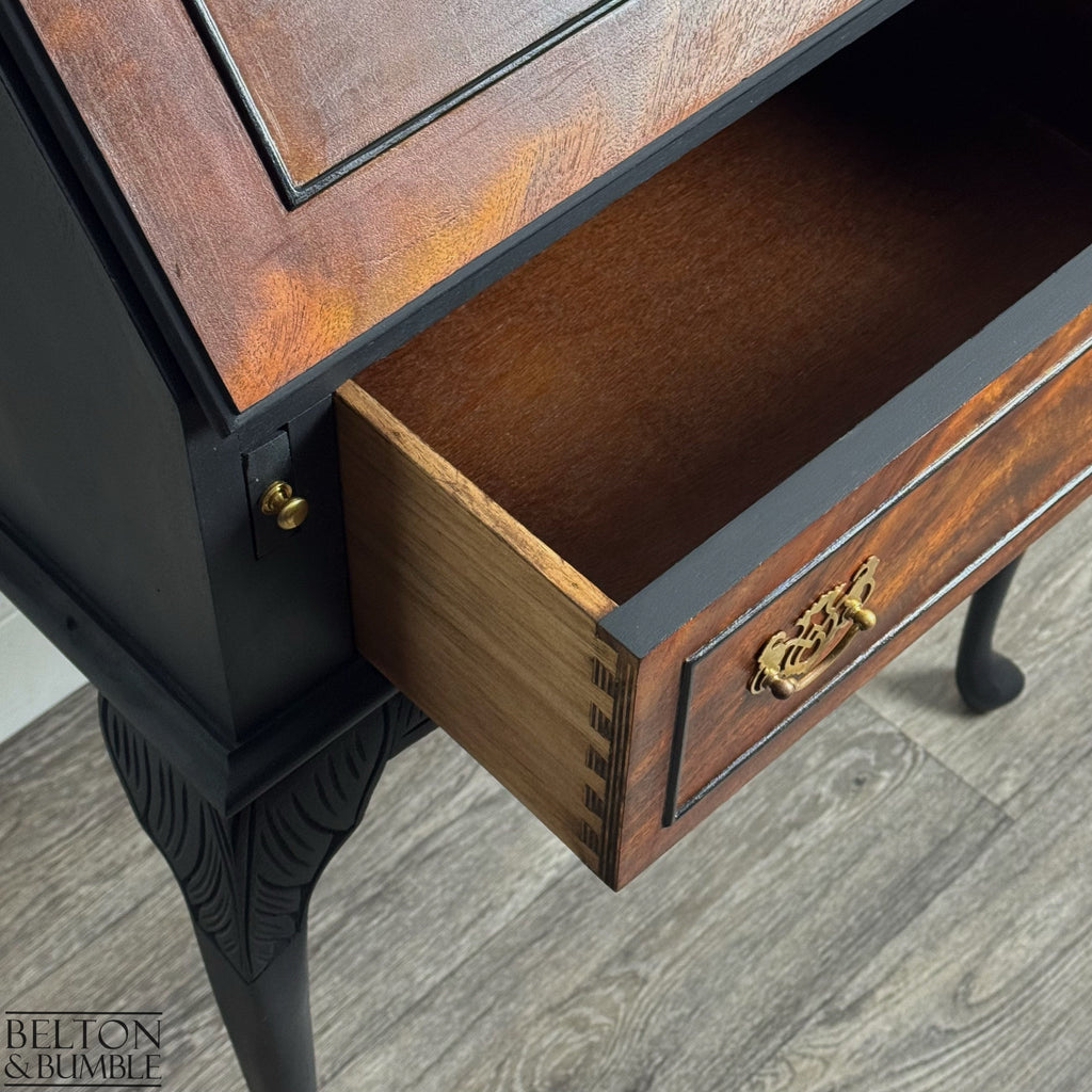Vintage bureau with open dovetail drawer revealing natural wood interior and burr walnut veneer