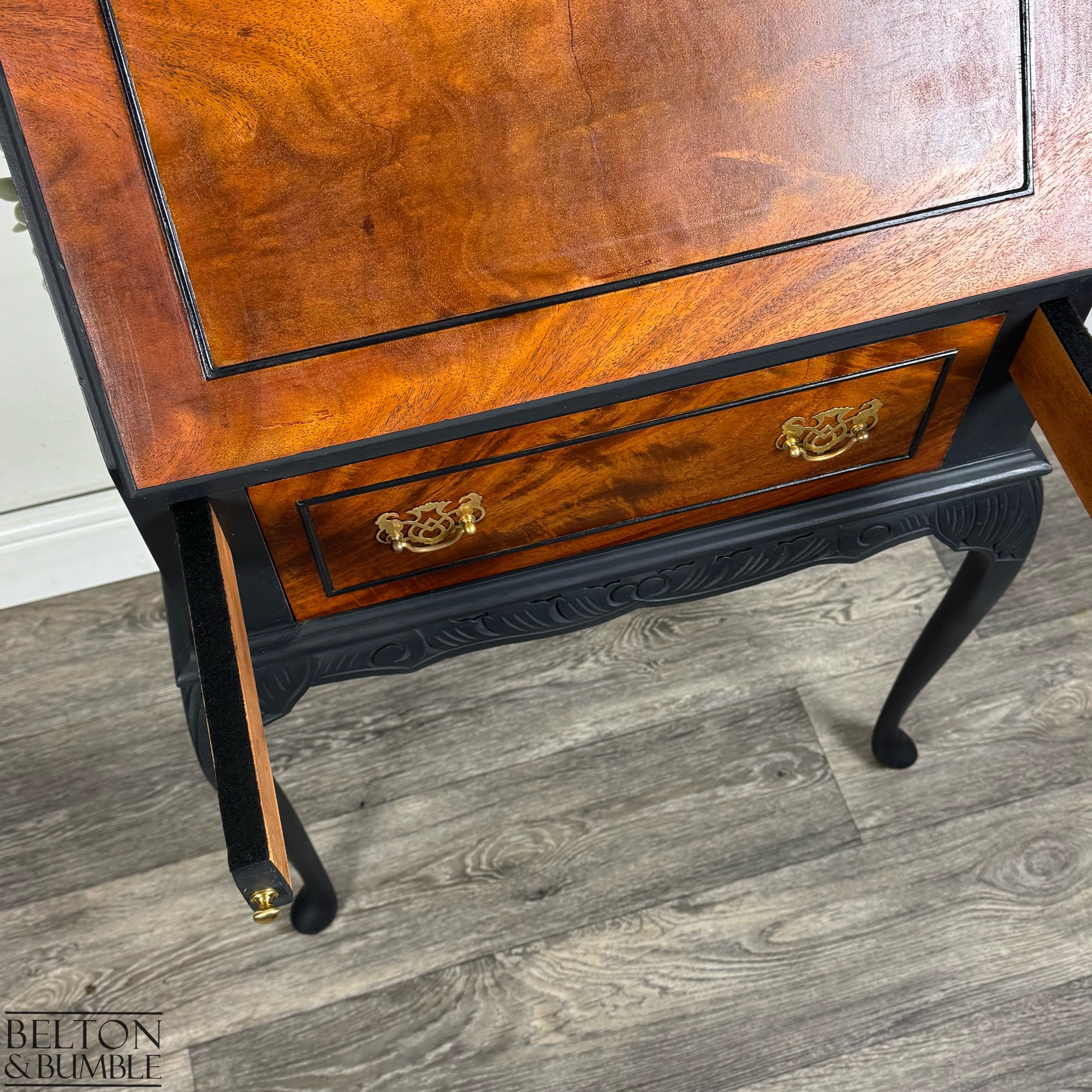 Close-up of bureau pull-out supports newly felted in black beneath burr walnut fall front