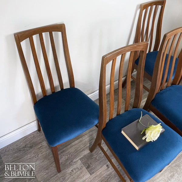 Set of Four Teak Dining Chairs with Navy Velvet – angled view showing proportions and stance