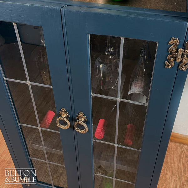 Solid Wood Carved Navy and Gold Cocktail Drinks Cabinet – Close-up of wood with navy, gold finish and glass doors