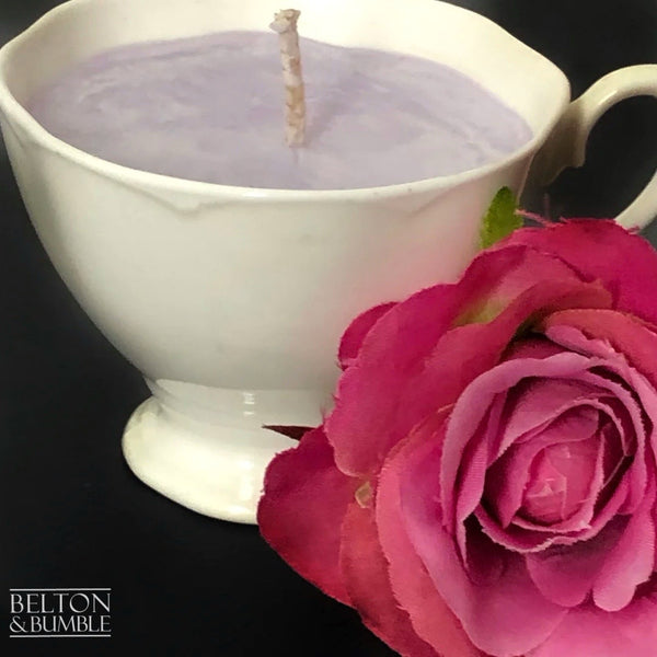 Soy Wax Petite Teacup with Black Cherry Scent - Side view of a soy wax candle in a classic teacup, scented with black cherry and paired with a deep pink rose decoration.