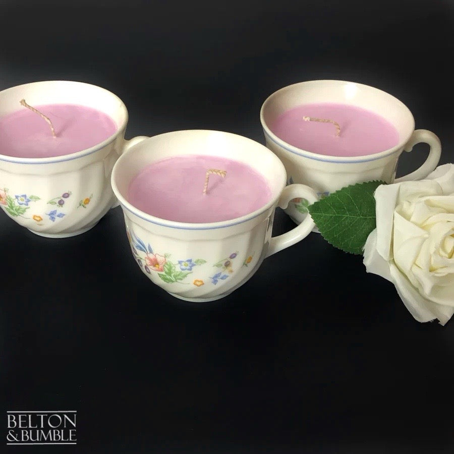 Soy Wax Vintage Teacup Candle with Orchid Scent  - Set of three orchid-scented soy wax candles in floral teacups, styled with a white rose on a dark background.