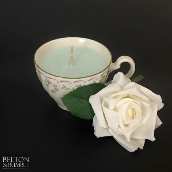 Soy Wax Vintage Teacup Candles with Green Apple Scent - Handmade soy wax candle with a pale green tint and cotton wick, set in a floral-patterned vintage teacup.
