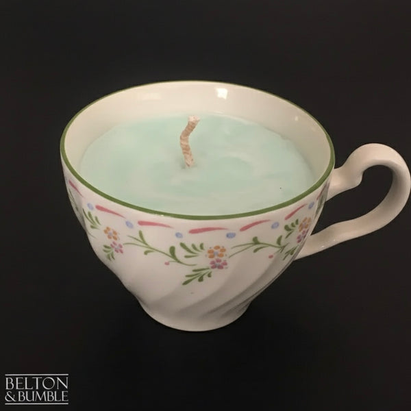 Soy Wax Vintage Teacup Candles with Green Apple Scent - Eco-friendly soy wax teacup candle scented with green apple, presented with a white rose accent against a dark background.