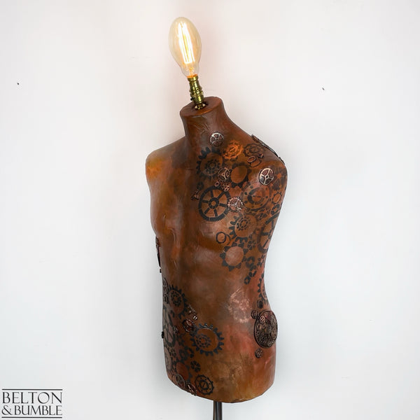 Steampunk Mannequin Floor Lamp with Black Wooden Stand - A steampunk-style mannequin floor lamp with a black wooden stand and a bulbous light fixture on top.
